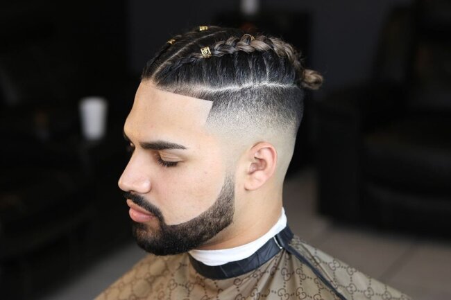 A sleek look with a braided high fade hairstyle. 
