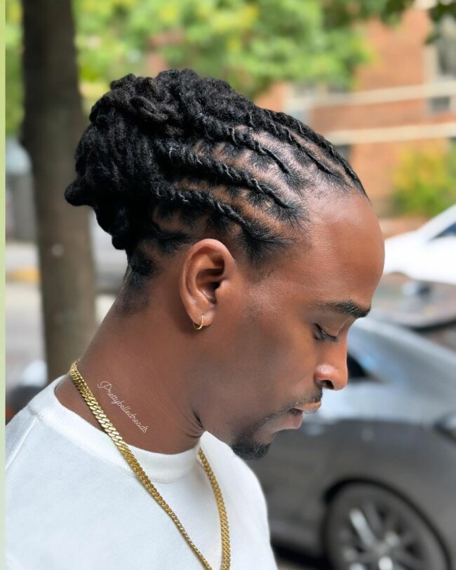 An easy-to-manage look with a braided man bun. 