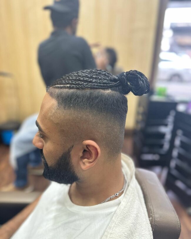 A stylish look with a braided mid fade. 