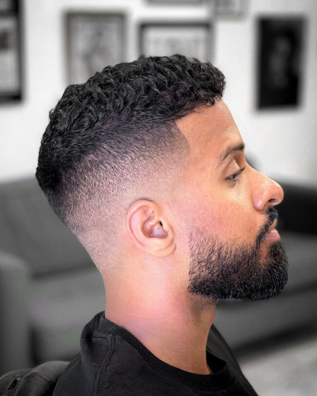 A classic appearance with a curly high top fade. 