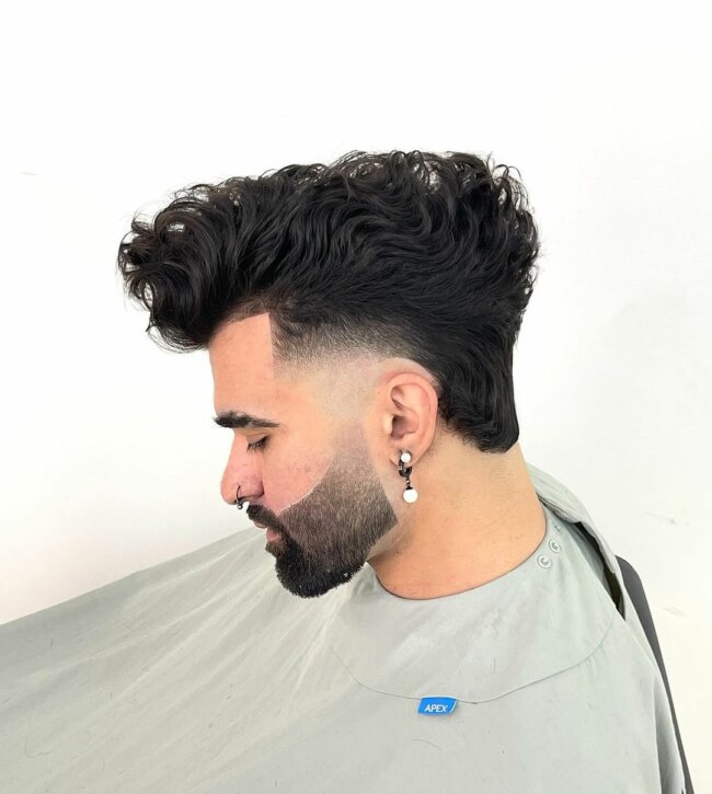 A cool look with a curly mohawk paired with an undercut. 