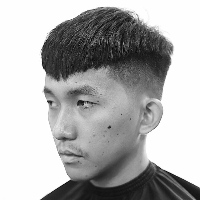 A bold and unique look with a high fade with short top. 