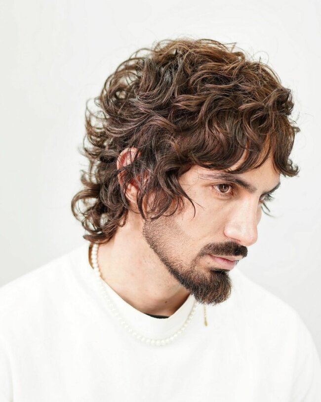 A sleek look with long curly hair. 