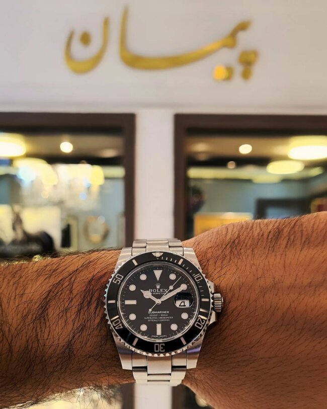 A cool look with a Rolex Submariner watch.