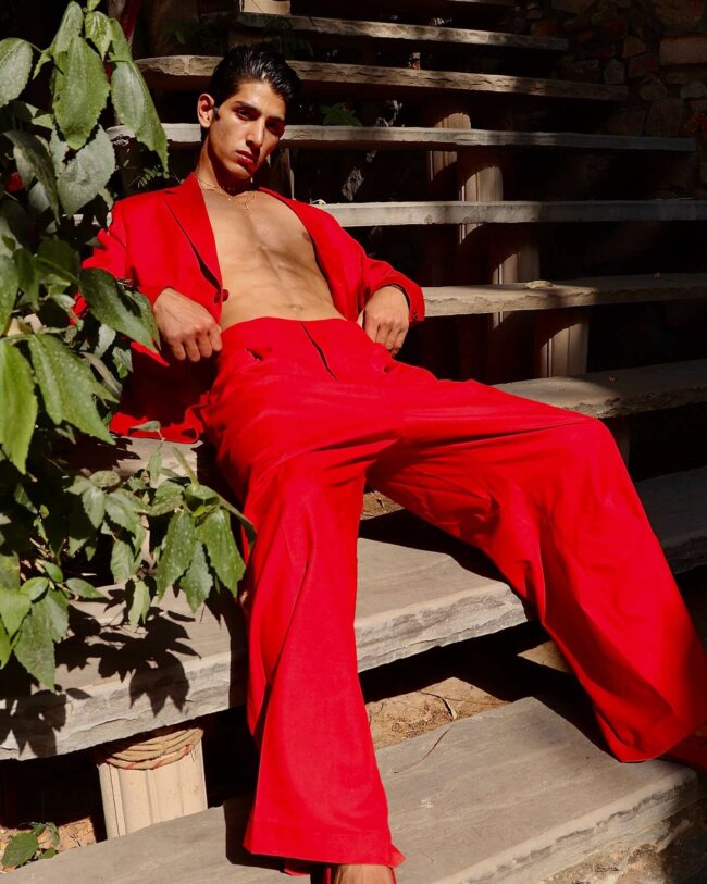 An edgy look with bright red suit.