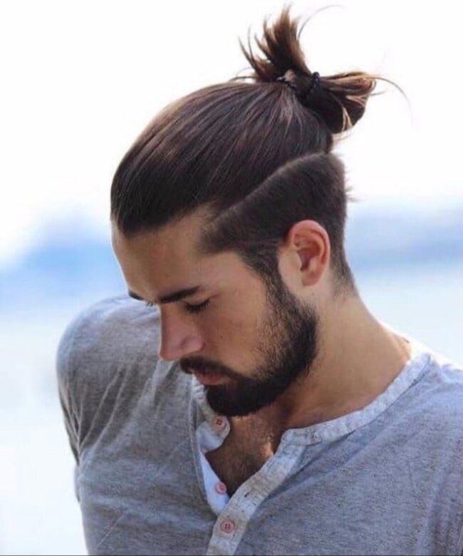 A classic look with bun and hard part. 