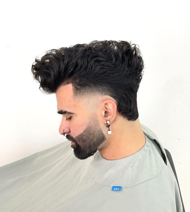 A bold look with curly quiff. 