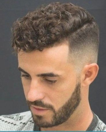 A bold look with curly top and shaved sides.