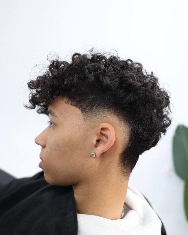 A bold look with curly undercut.