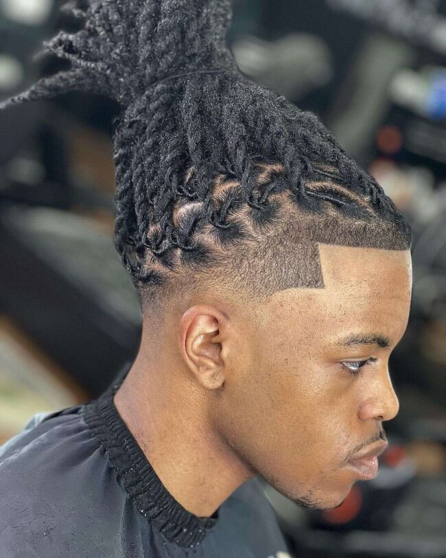 A refined look with a fade and dreads. 