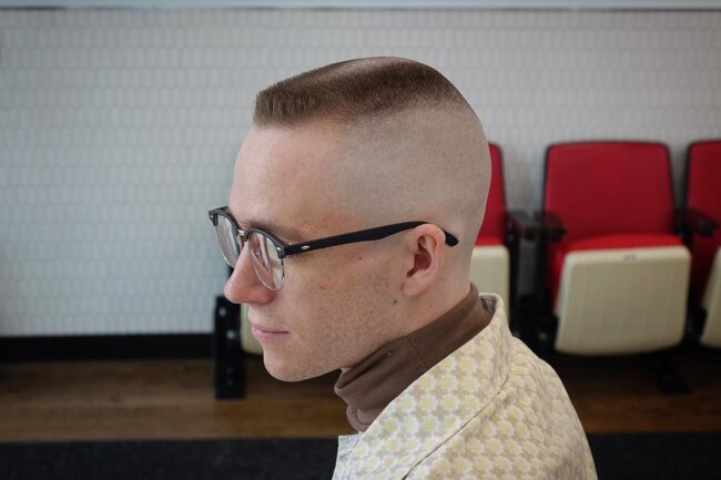 A cool look with flat top buzz cut. 