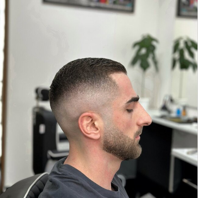 A cool look with high fade buzz cut. 