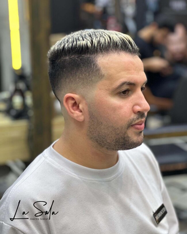 A striking look with high and tight with highlights. 