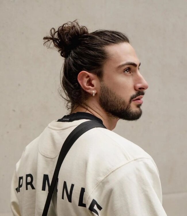 A refined look with man bun. 