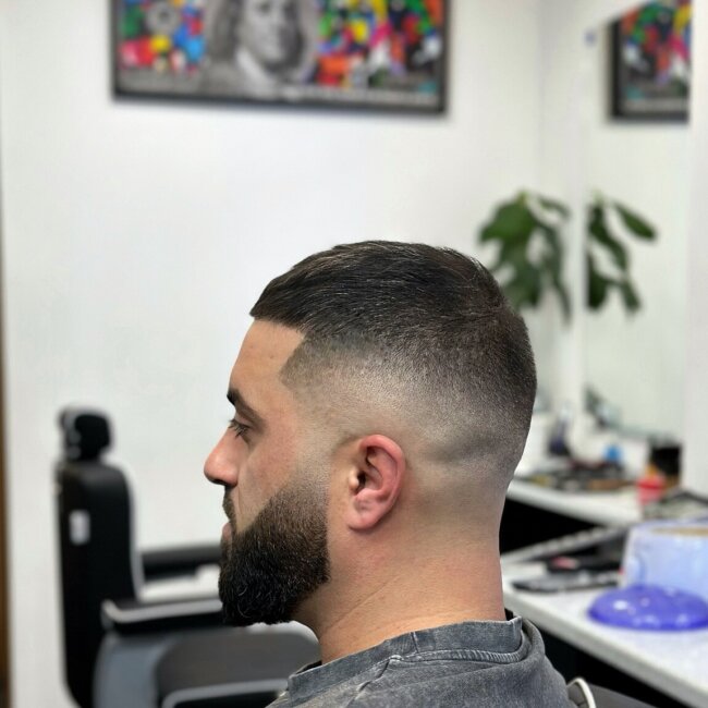 A bold look with mid fade buzz cut. 