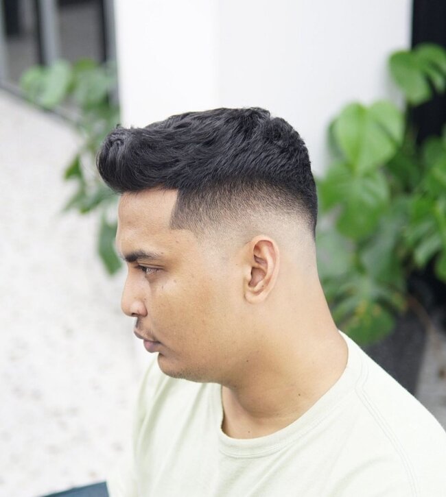 A bold look with mid fade quiff. 