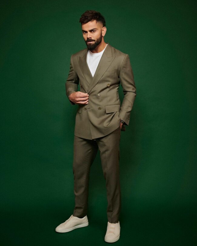 A classy look with olive green suit. 