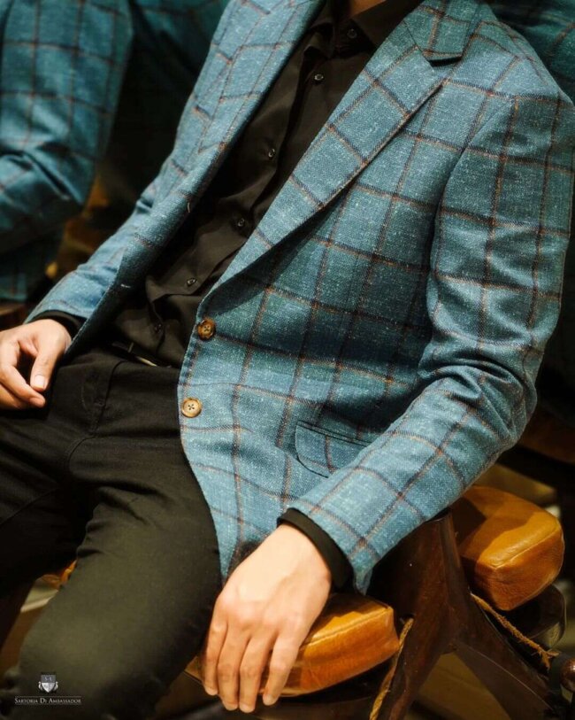 A contrasting look with plaid suit.