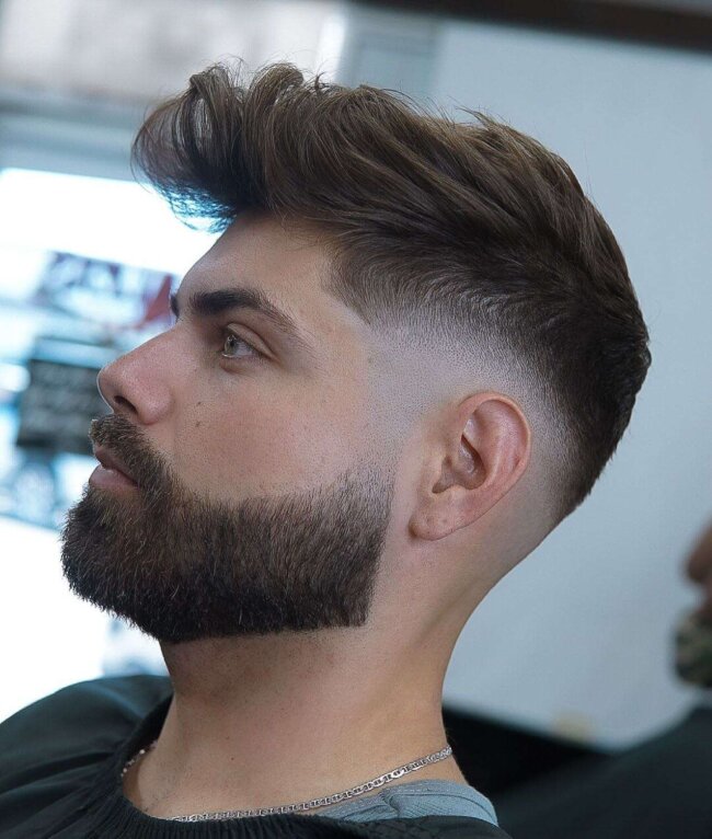 A bold look with shaved sides and beard. 