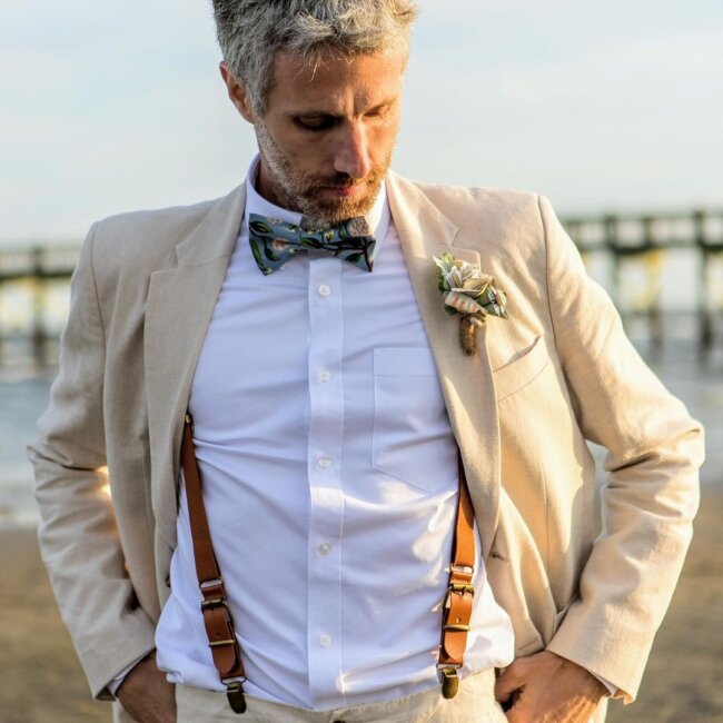 A refined look with suspenders and suit. 