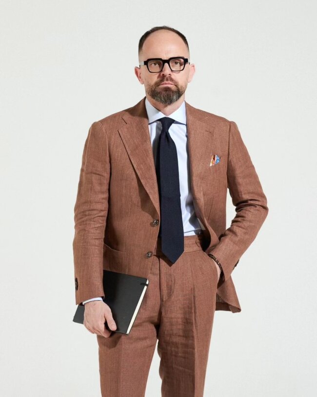 A classic look with a tan suit.