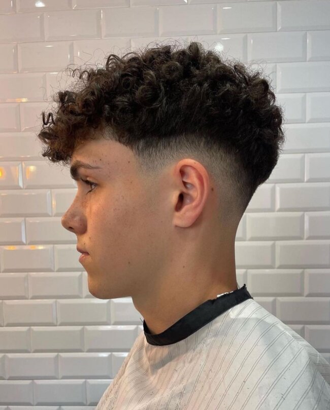 A classy look with tapered curly top. 