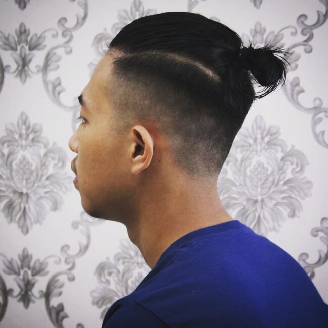 A sleek look with top knot and undercut. 