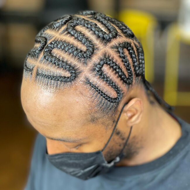 A refined look with zigzag cornrows.
